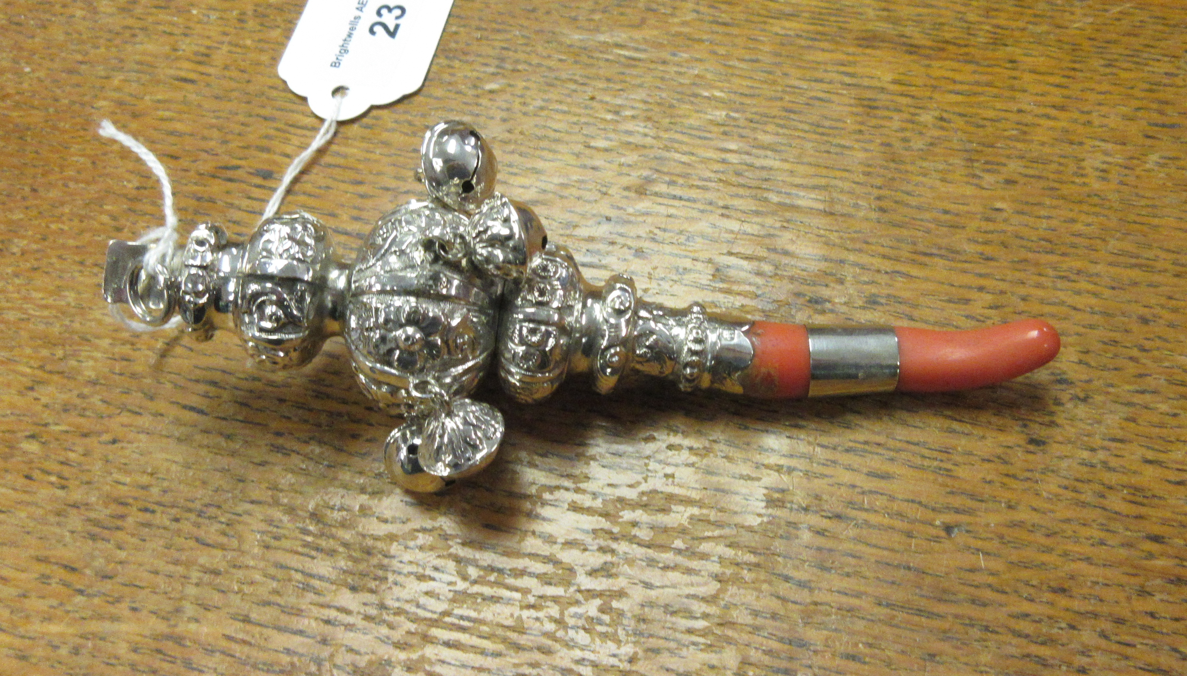 A Victorian silver Rattle with floral embossing and five applied bells, Birmingham circa 1890