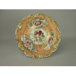 A Chamberlain Worcester porcelain Plate with shaped edge, panels of flowers on a salmon pink