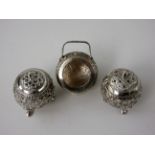 An Indian silver three piece Condiment Set with floral and scroll design
