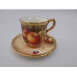 A Royal Worcester Coffee Cup and Saucer, the cup painted apples, grapes, on a mossy ground, signed