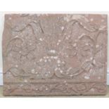 An 18th Century Mughal carved red sandstone architectural fragment,Decorated with a lotus, 21 x 27