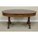 A 19th Century oval rosewood Library Table fitted frieze drawer on each side, on two tapering barrel
