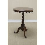 A 19th Century rosewood Occasional Table with shaped frieze on spiral column and tripod base, 20in