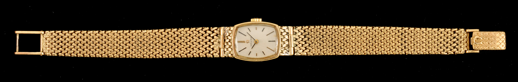 A Lady's Omega Wristwatch the rectangular dial with baton markers on integral woven link bracelet in