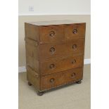 A 19th Century teak Military Chest of two short and three long drawers with inset turned knobs on