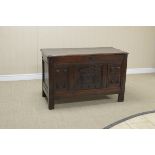 A 17th Century oak Coffer with moulded top and panelled front, 3ft 9in W