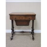 A Victorian burr walnut Card/Sewing Table with satinwood inlaid fold-over top above drawers and