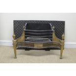 A Regency brass fronted and cast iron serpentine Fire Basket with four urn finials and pierced