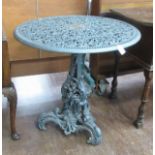 A Dutch rococo revival cast iron Garden Table after a design by L.I. Entoren, on floral scroll