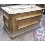 A 19th Century oak Cellaret, the panelled moulded lid above a similar front and sides, raised on a