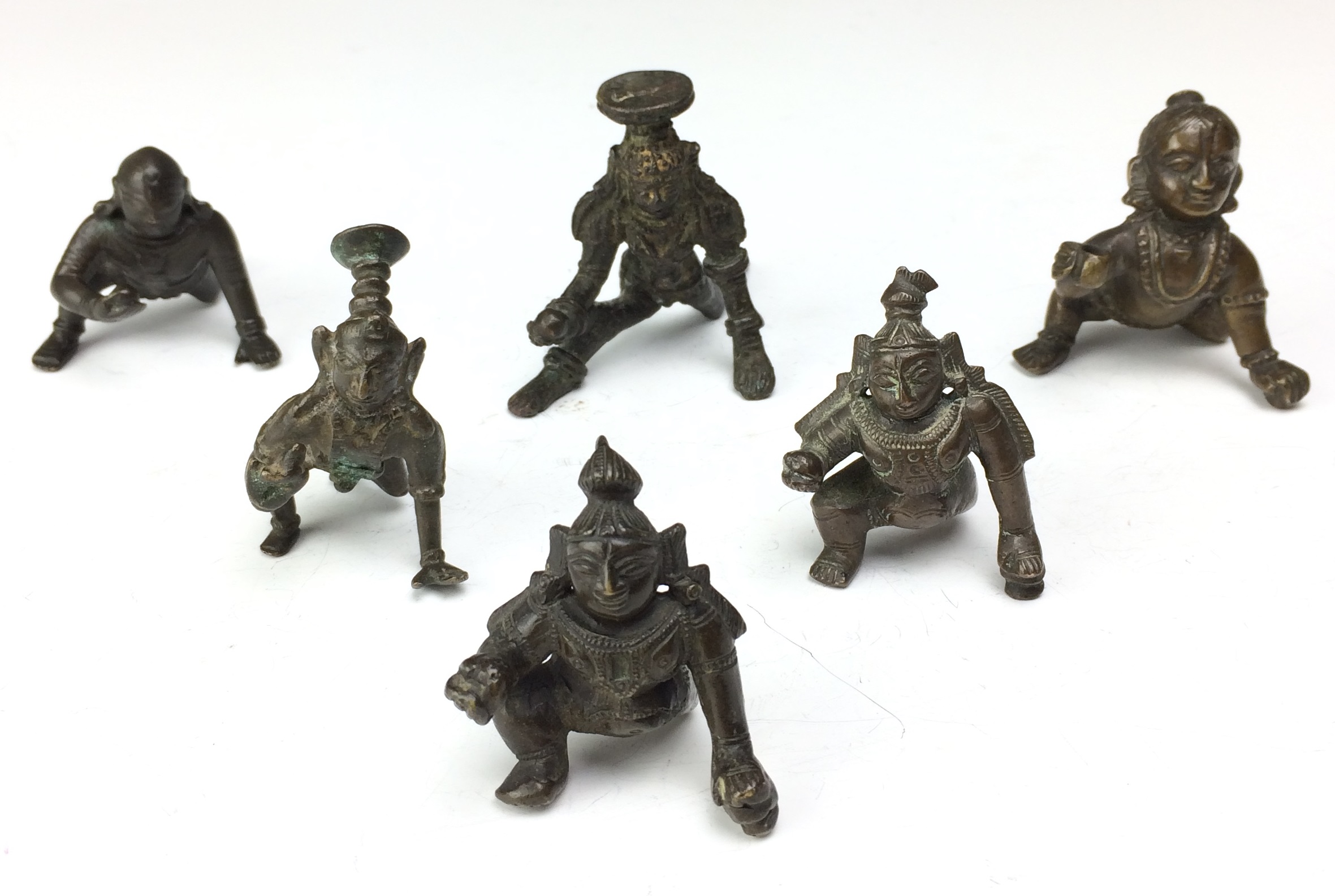 Another six small Indian bronze Figures of Krishna, 19th/ 20th Century,As the butter thief,