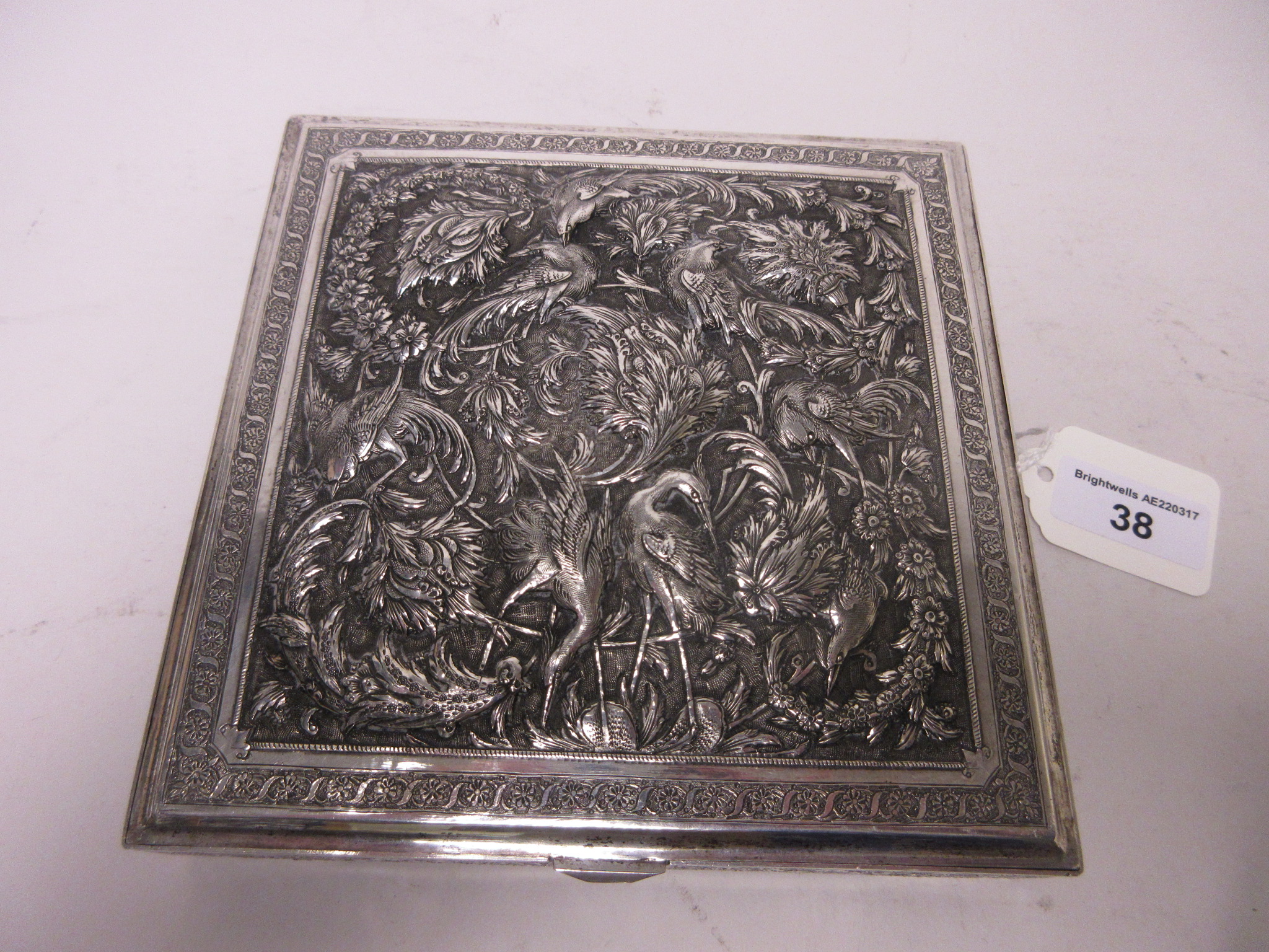 A Persian silver square Box with hinged cover finely embossed and chased with exotic birds amongst - Image 2 of 6