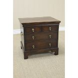 An antique oak Commode Chest with hinged top, four dummy drawers on bracket feet, 21in W