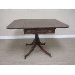 A Regency mahogany Pembroke Table fitted end drawer with ebonised stringing, lion mask and ring