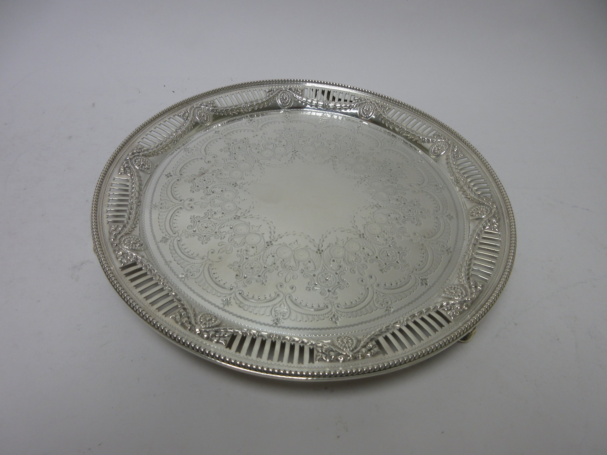 A Victorian circular Salver with scroll and rosette engraving, pierced floral swag and beaded border - Image 3 of 5