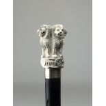 An Indian white metal mounted "Ashoka Column" Walking Cane, With knobbed black lacquered shaft