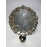 An Edward VII silver circular Salver with presentation inscription, scroll and gadroon border on
