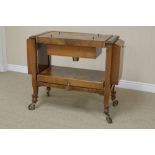 A figured walnut metamorphic Drinks Trolley with removable lid revealing cocktail shaker etc, side