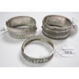 Three Victorian silver hinged Bangles each with engraving to front