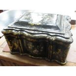 A 19th Century papier maché Sewing Box of shaped rectangular outline, the lid revealing a fitted