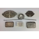 A group of Indian silver items, 19th/20th Centurycomprising two belt buckles, two cigarette cases, a