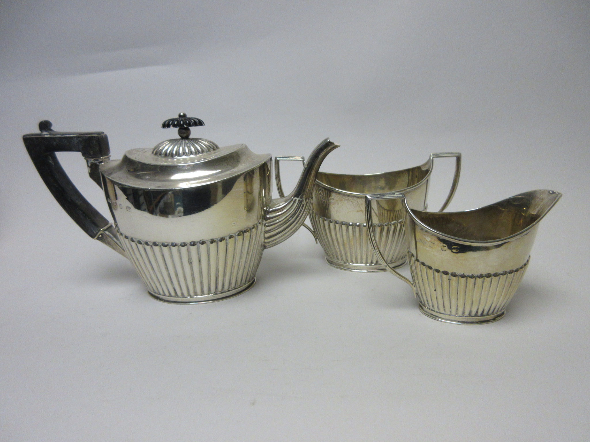 A Victorian silver three piece Tea Service of oval semi-fluted form, Birmingham 1894 and a - Image 2 of 2