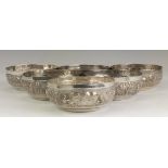 A set of six 19th Century Indian silver plated Bowls,Calcutta, Repousse decorated with rural