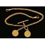 A 9ct gold graduated double Watch Albert with two half sovereign fobs, approx 29gms