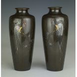 A pair of Japanese bronze Vases, late Meiji period, inlaid with cockerels perched on flowering