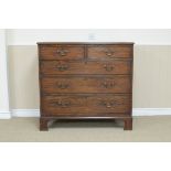 A George III mahogany Chest of two short and three long drawers on bracket feet, 3ft 9in