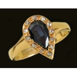 A Sapphire and Diamond Cluster Ring pavé-set pear-cut sapphire within frame of rose-cut diamonds