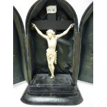 A 19th Century carved ivory Crucifix, 7in, in case and a carved ivory Work Ball