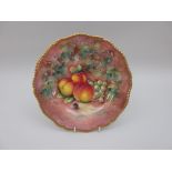 A Royal Worcester Plate with shaped moulded edge, gilded painted peaches, cherry and grapes on a