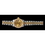 A Lady's Rolex Oyster Perpetual Datejust Wristwatch, the champagne dial with diamond dot markers,