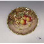 A Royal Worcester porcelain Plate painted apples and grapes with shaped gilt rim, signed G. Banks,