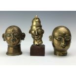 Two 19th Century Indian brass Gauri Heads and a Shiva Mask,Maharashtra, Largest 3 ½ in high (3)