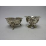 A Victorian silver circular Bowl with beaded rim and cartouches on hoof feet, London 1875, and a