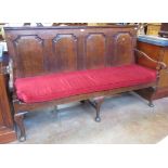 An antique oak Settle with four fielded panel back on cabriole front supports, 6ft W