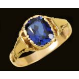 A Dress Ring set mixed-cut synthetic blue stone in moulded mount stamped 585, ring size N