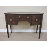 An early 19th Century mahogany bow front Sideboard fitted three drawers on square tapering legs, 3ft