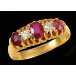 A Ruby and Diamond five stone Ring pavé-set oval-cut ruby between two old-cut diamonds and two