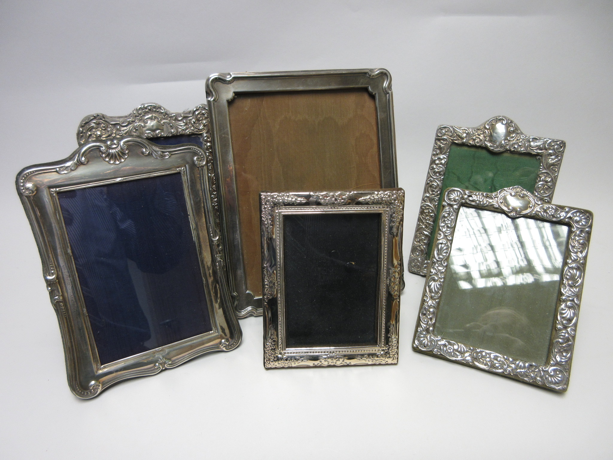 A George V silver Photograph Frame, Sheffield 1921, 9 1/2 x 7 1/2in and five other Frames, mostly