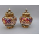 A pair of Royal Worcester Pot Pourri Vases and Covers with inner lids, painted peaches, apples,