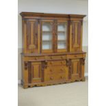 A Victorian stained and grained Dresser with glazed doors flanked by cupboard doors, the base fitted