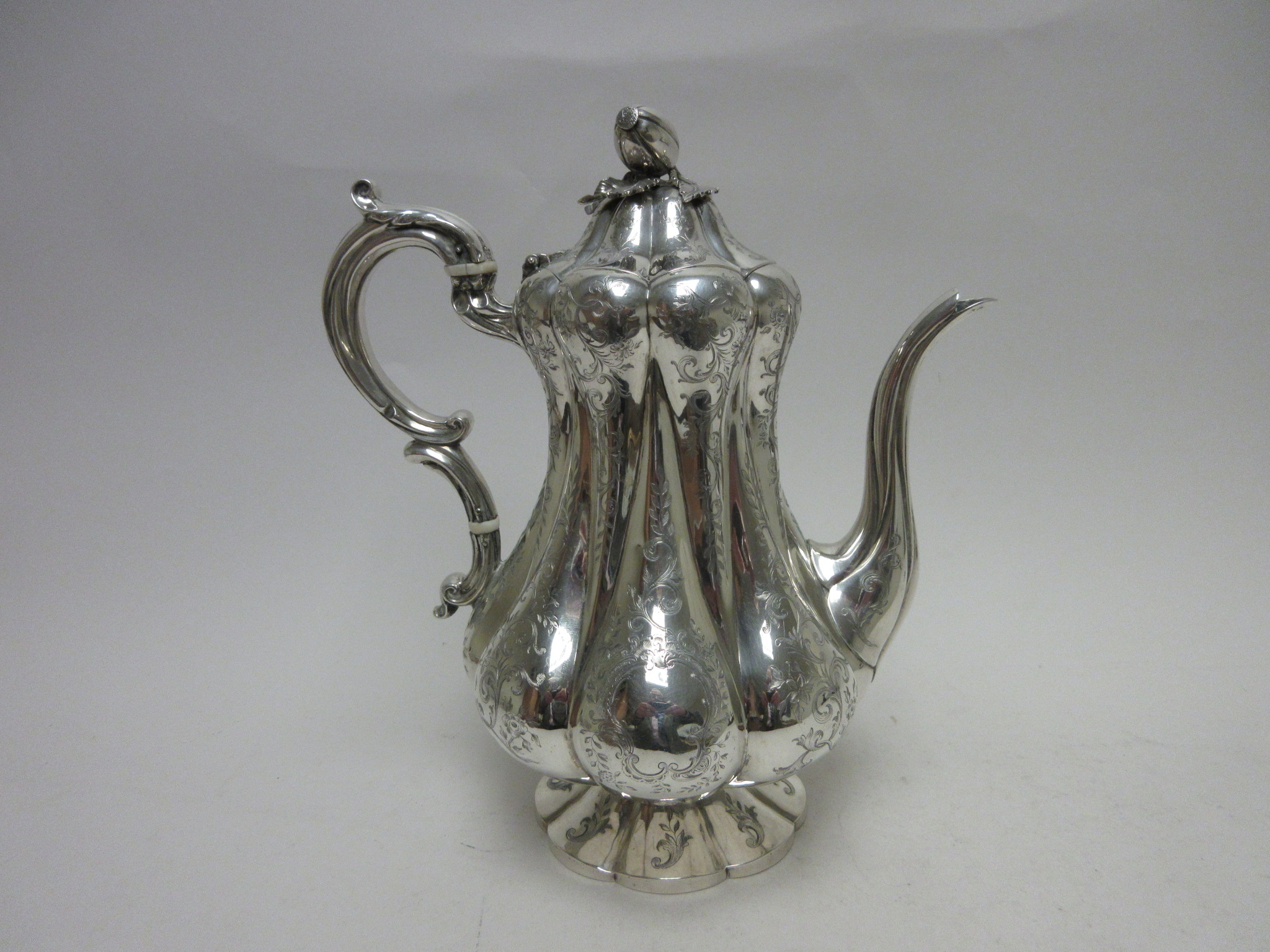 A Victorian silver Coffee Pot of pear shape with leafage scroll engraving, melon finial, London - Image 6 of 7