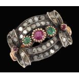 A multi-gem Cocktail Ring claw-set round ruby between two emeralds within intricate plaque pavé-