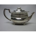 A George III silver boat shape Teapot engraved crest, gadroon and scallop rim, London 1815