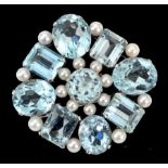 An Aquamarine and Cultured Pearl Cluster Brooch claw-set round mixed-cut stone within a frame of
