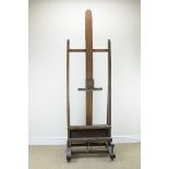 A large oak Easel with corkscrew rise and fall mechanism, 6ft 9in