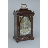 A George III mahogany Bracket Clock having caddy top, arched brass dial inscribed Edward Pistor,